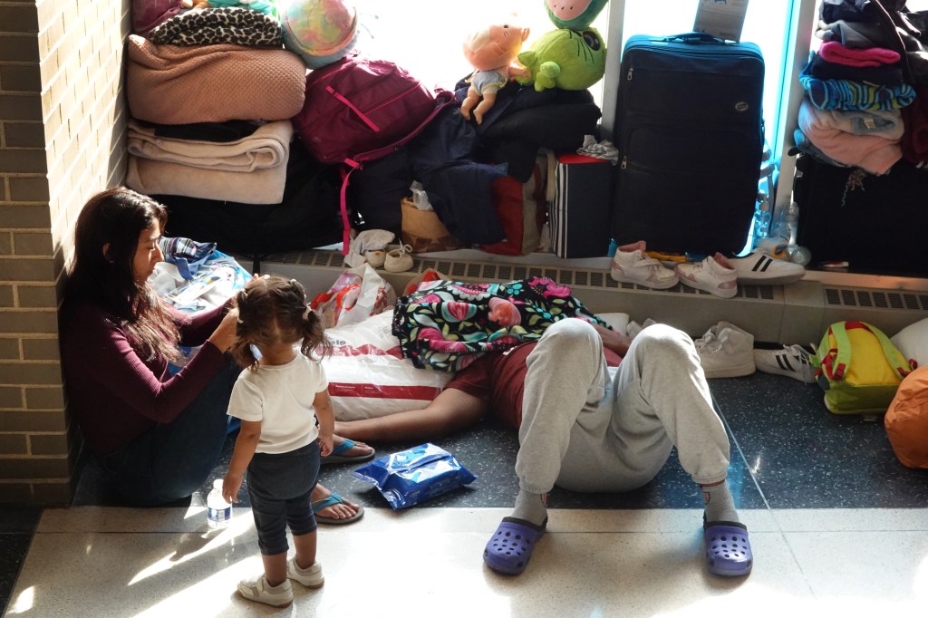 Immigrants sleeping on the floor of a Chicago precinct earlier this year.