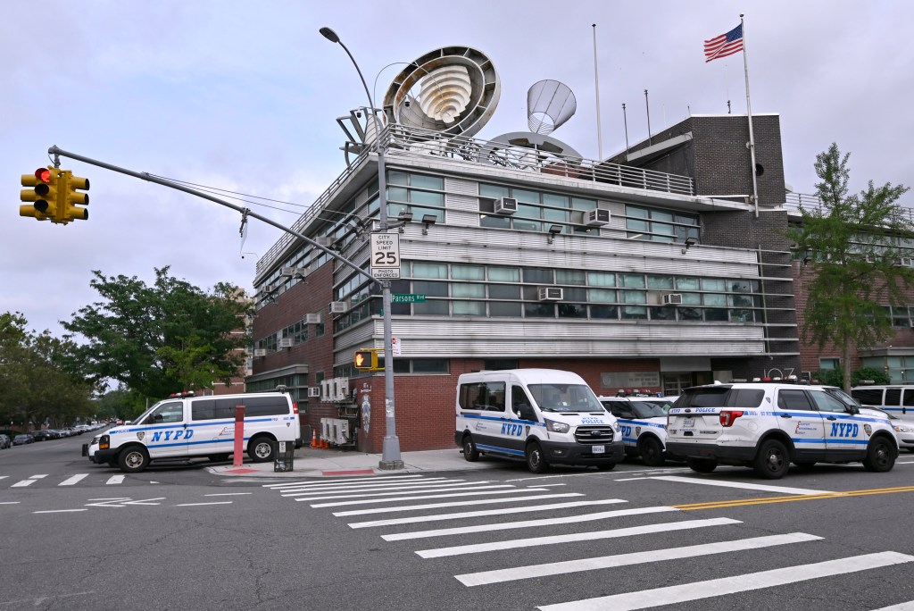 The NYPD's 107th Precinct headquarters in Queens was evacuated after a man entered holding a rusted gun and grenade.