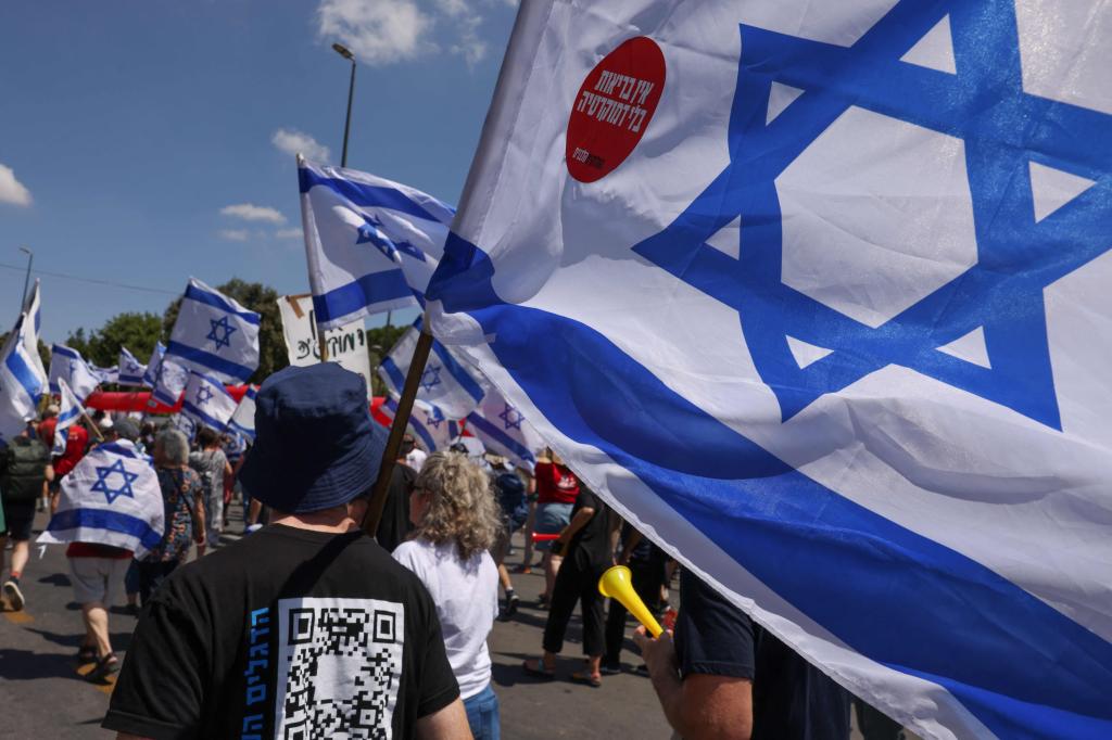 Man holding an Israeli flag