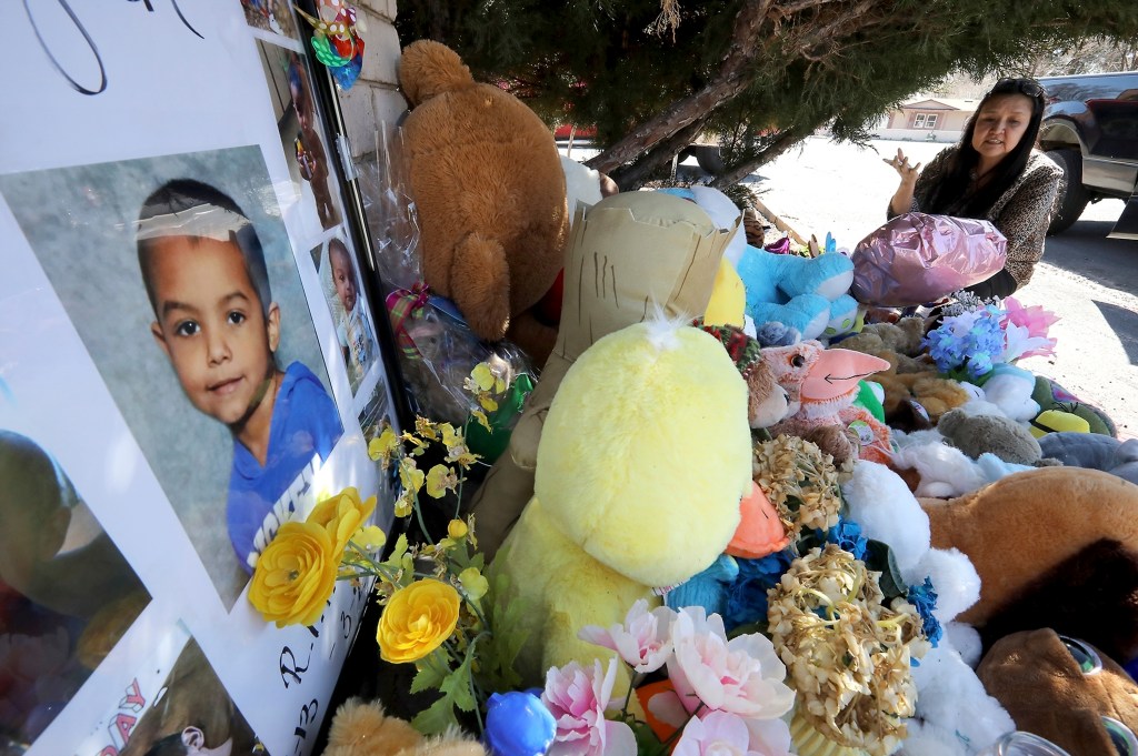 In this March 4, 2020, file photo, Wanda Ahasteen stops by a memorial for Deshaun Martinez in Flagstaff, Ariz.