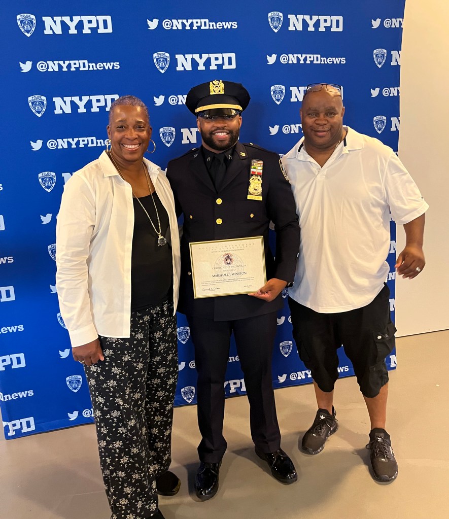 Marshall Winston Jr. with his two parents Candra and Marshall Winston Sr.