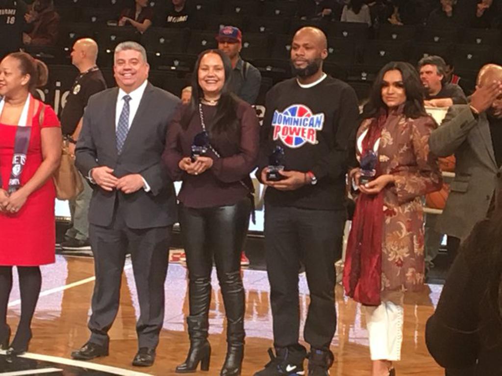 Ming (center) was honored by the Brooklyn Nets for her Dominican heritage.