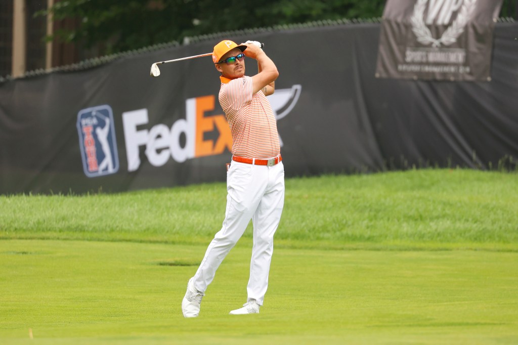 PGA golfer Rickie Fowler hits his approach shot