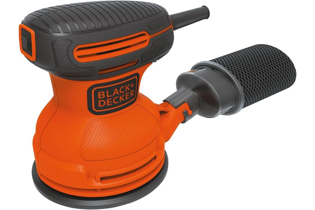 An orange sander with black grip and dust collector. 