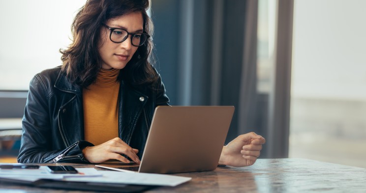 Woman fills out a loan application online