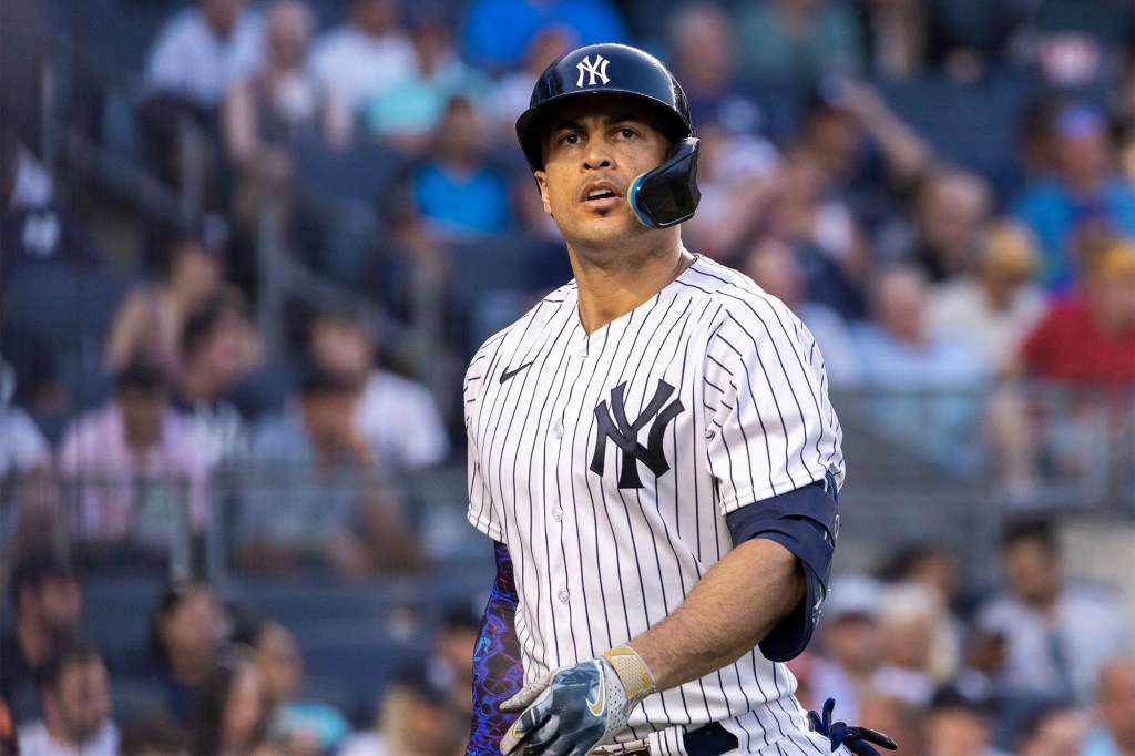 Giancarlo Stanton walks toward the Yankees' dugout after striking out during a July 5 game.