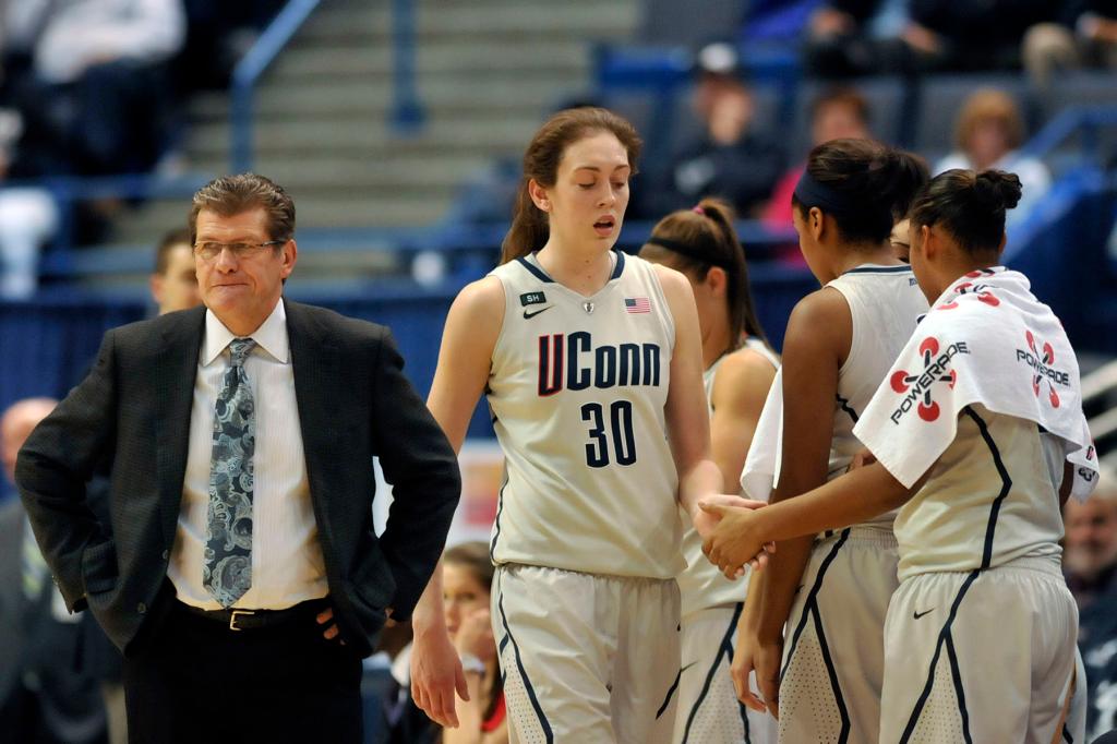 Breanna Stewart checks out of the game with UConn coach Geno Auriemma standing by.