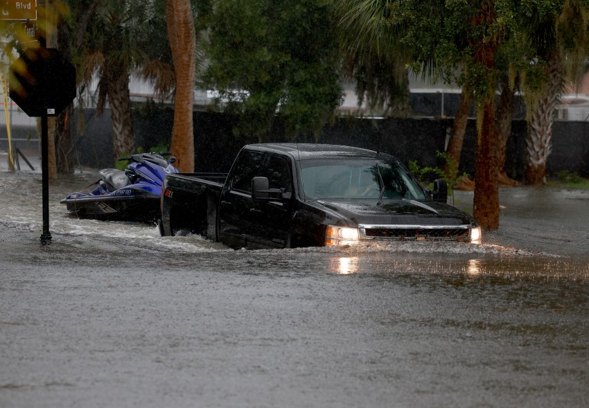 A car nearly submerged in flood water in Tarpon Springs.