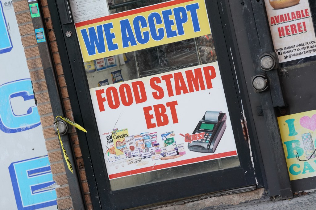 A general view of a We Accept Food Stamp EBT sign in the Bronx, NY as seen on September 19, 2019. 