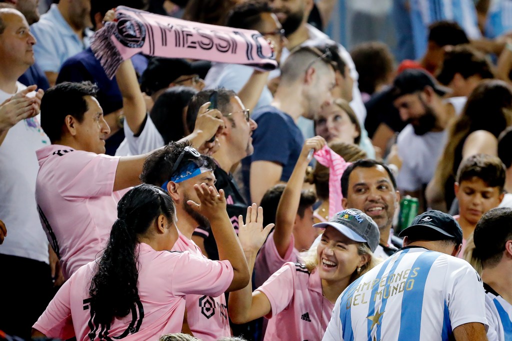 Fans celebrate Lionel Messi's goal in the 89th minute of the game. 