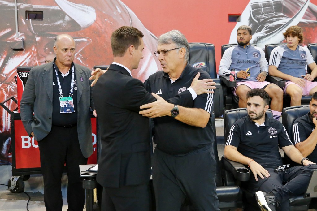 Red Bulls head coach Troy Lesesne (left) and Inter Miami CF head coach Tata Martino embrace before the game.