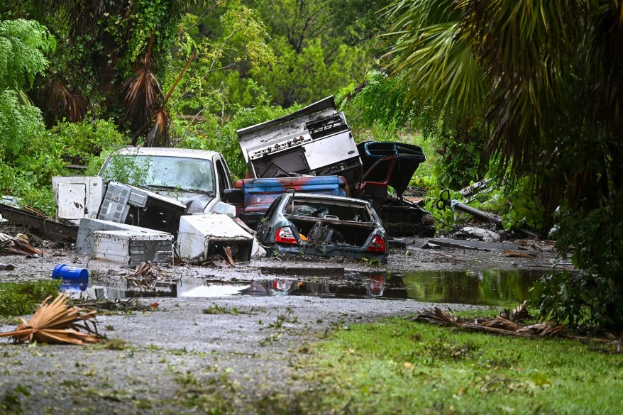 Flooded cars are piled on top of each other in Steinhatchee, Florida in the aftermath of Hurricane Idalia.