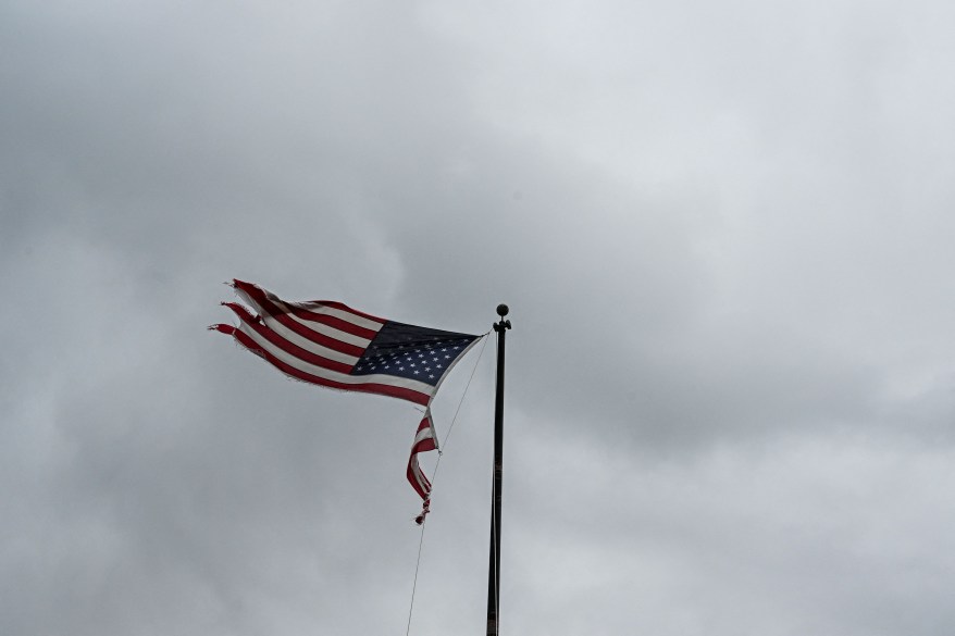 A torn US flag waves in the air in the aftermath of Hurricane Idalia.