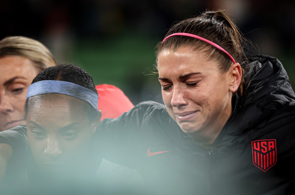 Alex Morgan of The United States shows her emotions after being knocked out during the FIFA Women's World Cup.