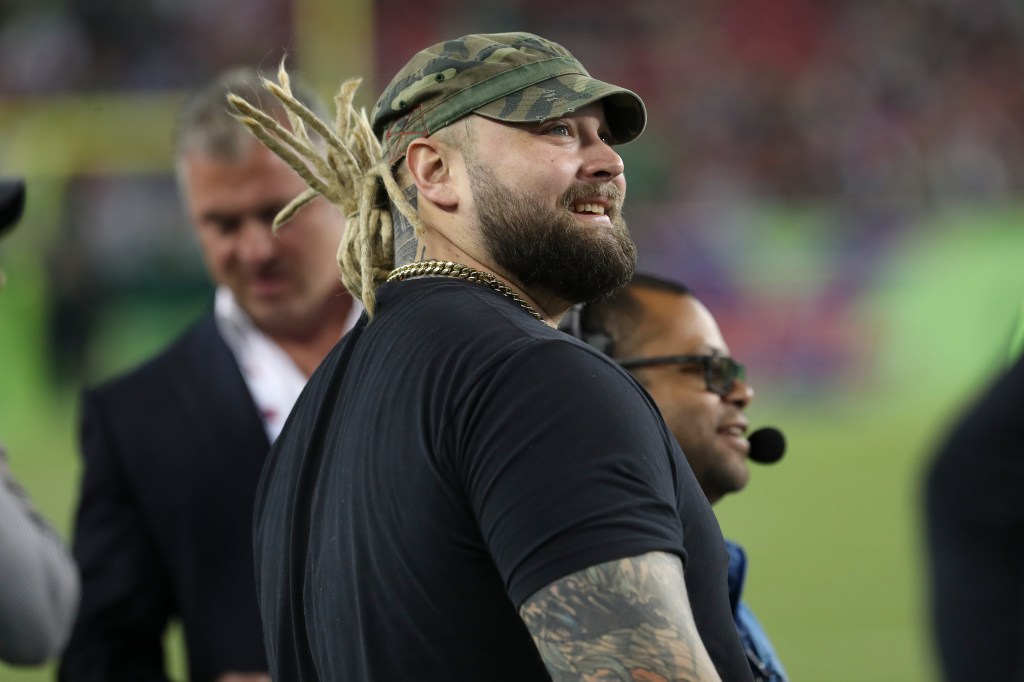 WWE wrestler Bray Wyatt watches from the sideline during the XFL game 