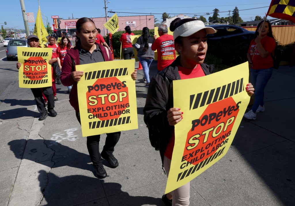 Fast food workers protest at the closed Popeyes Louisiana Chicken 