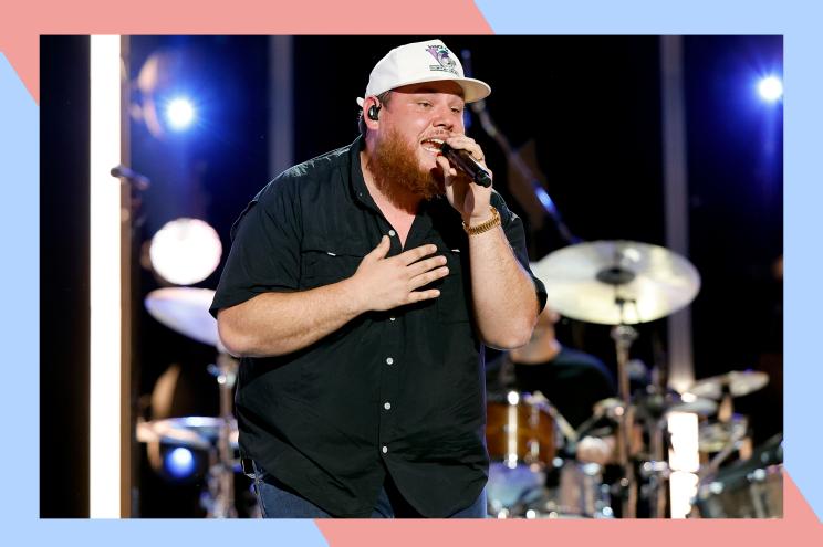 Country star Luke Combs sings onstage.