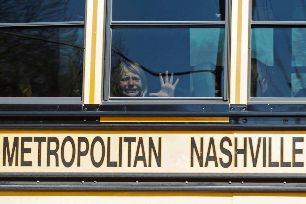 A child weeps while on the bus leaving The Covenant School, following a mass shooting at the school in Nashville, Tennessee, U.S. March 27, 2023.