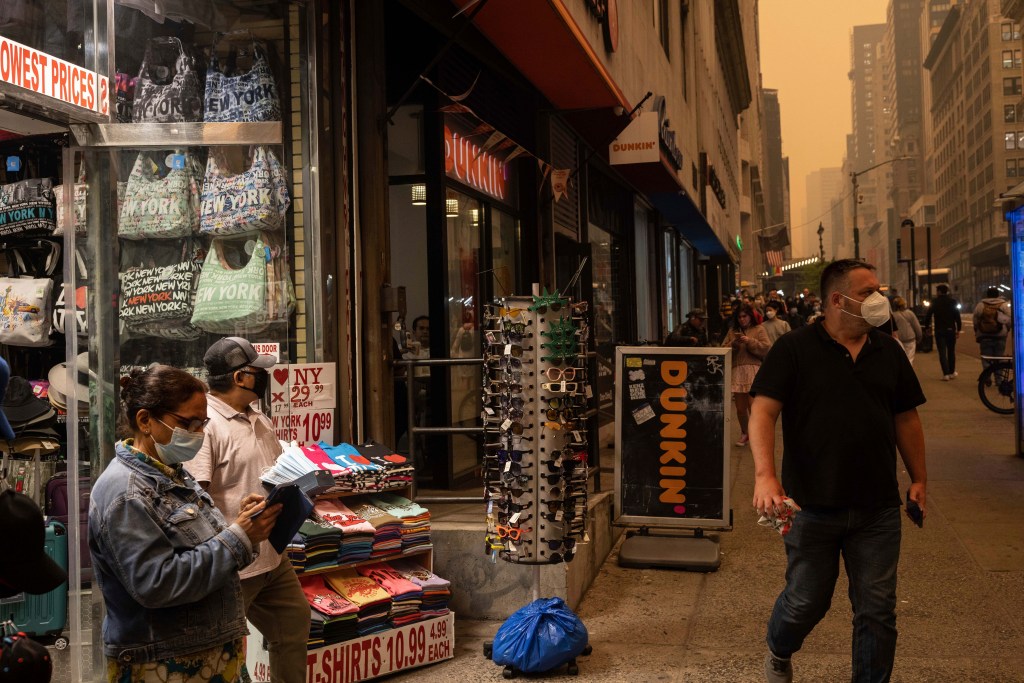 People wearing masks outside on June 7 in New York City. 