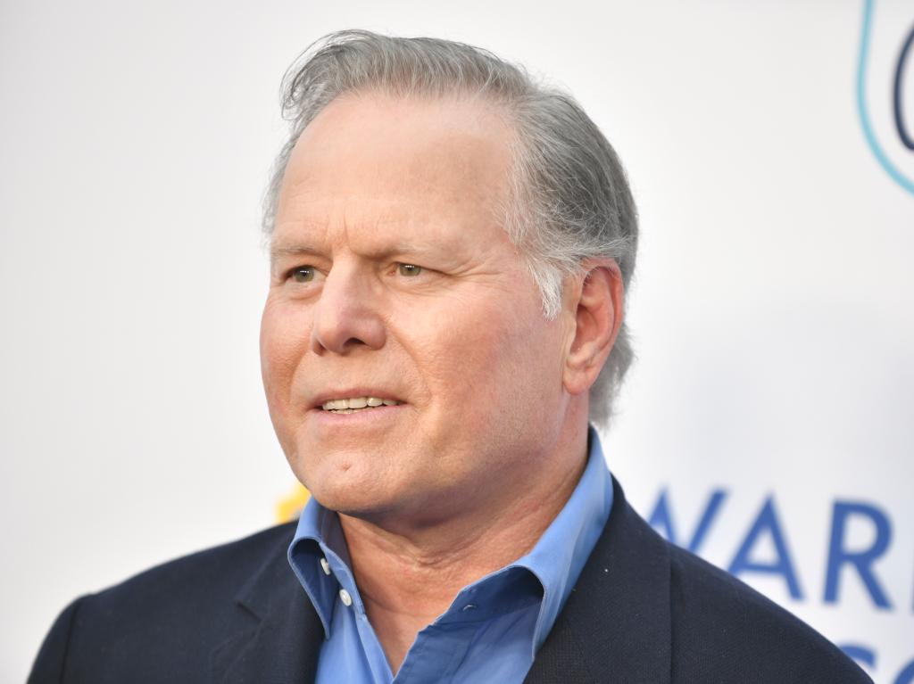 Warner Bros Discovery CEO David Zaslav said the company continues to pay down its debt and expects its streaming unit to be profitable next year, despite some headwinds including a dip in subscribers and ad revenue.