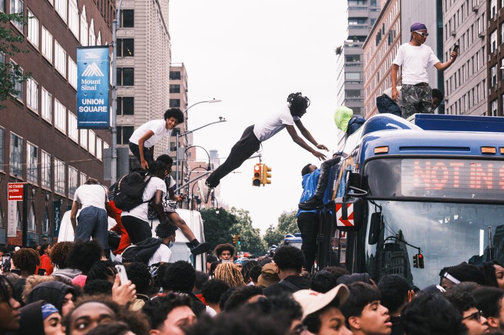 Cenat's followers jumping on a MTA bus.