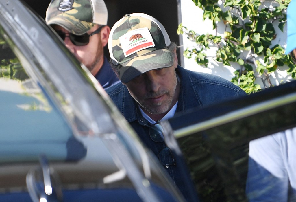 A photo of Hunter Biden leaving Kevin Morris' house, wearing a California baseball cap.