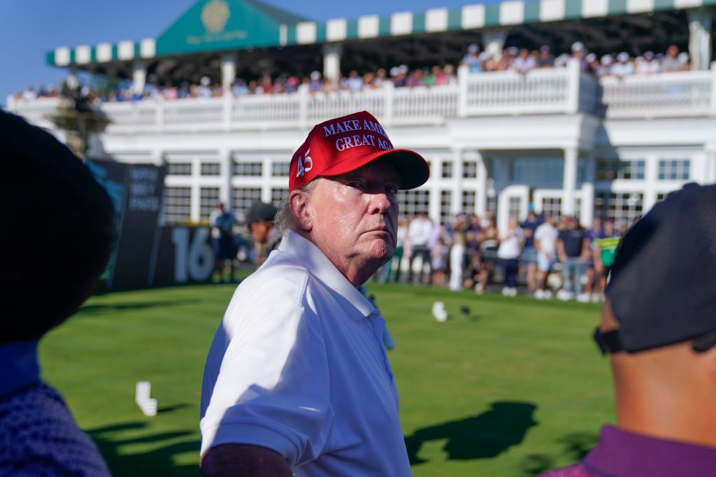 Former President Donald Trump looks over the crowd during the final round of the Bedminster Invitational LIV Golf tournament in Bedminster, N.J., Sunday, Aug. 13, 2023