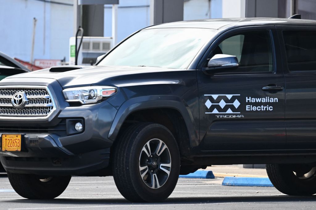 The Hawaiian Electric logo is displayed on a vehicle outside the electric power utility company's office.