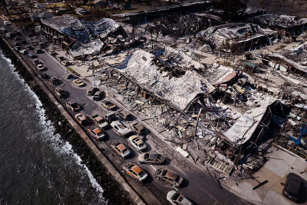 Destroyed vehicles and buildings following a wildfire last week on Wednesday, August 16, 2023 in Lahaina, Hawaii.  