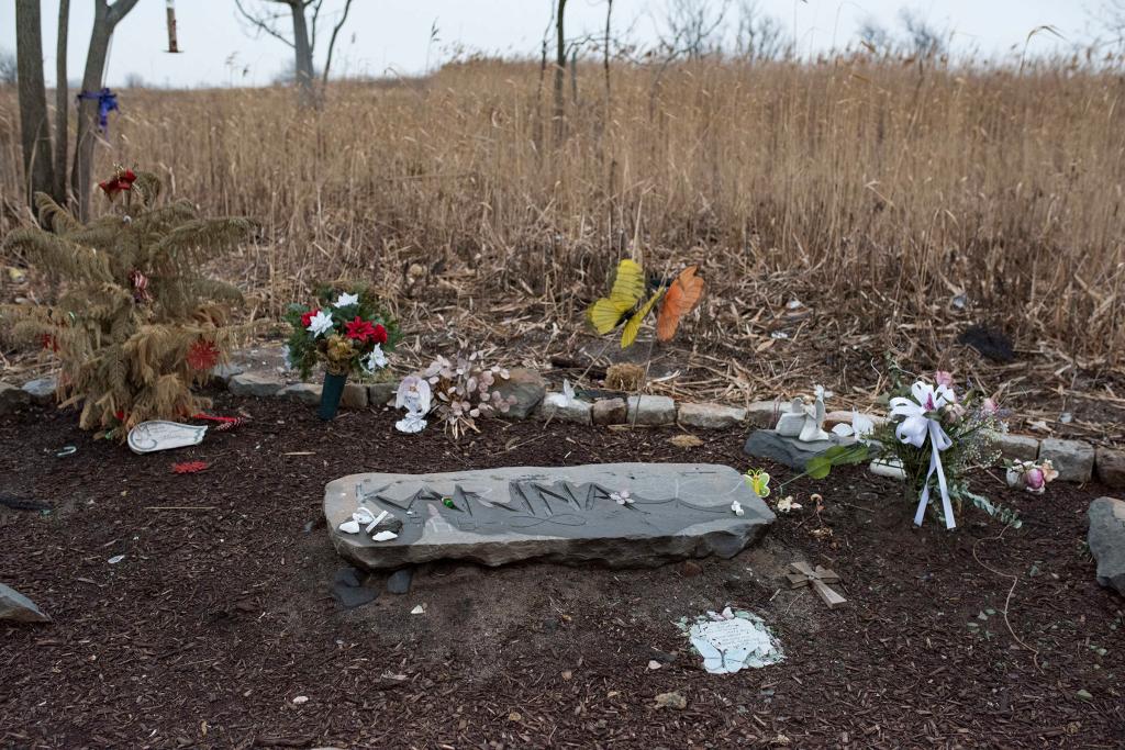 A memorial is set up where Karina Vetrano was found dead in August 2016.