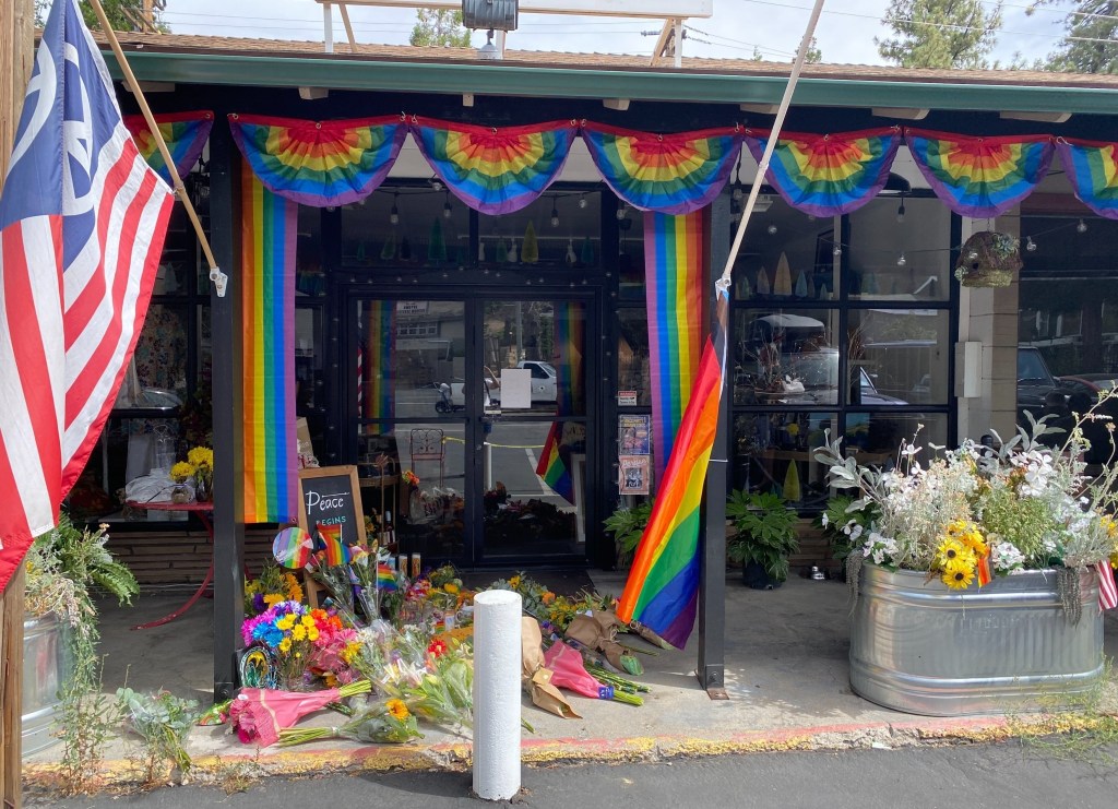 Carelton's store, Magpi, was draped in pride flags and flowers in tribute after she was murdered over a flag on Friday