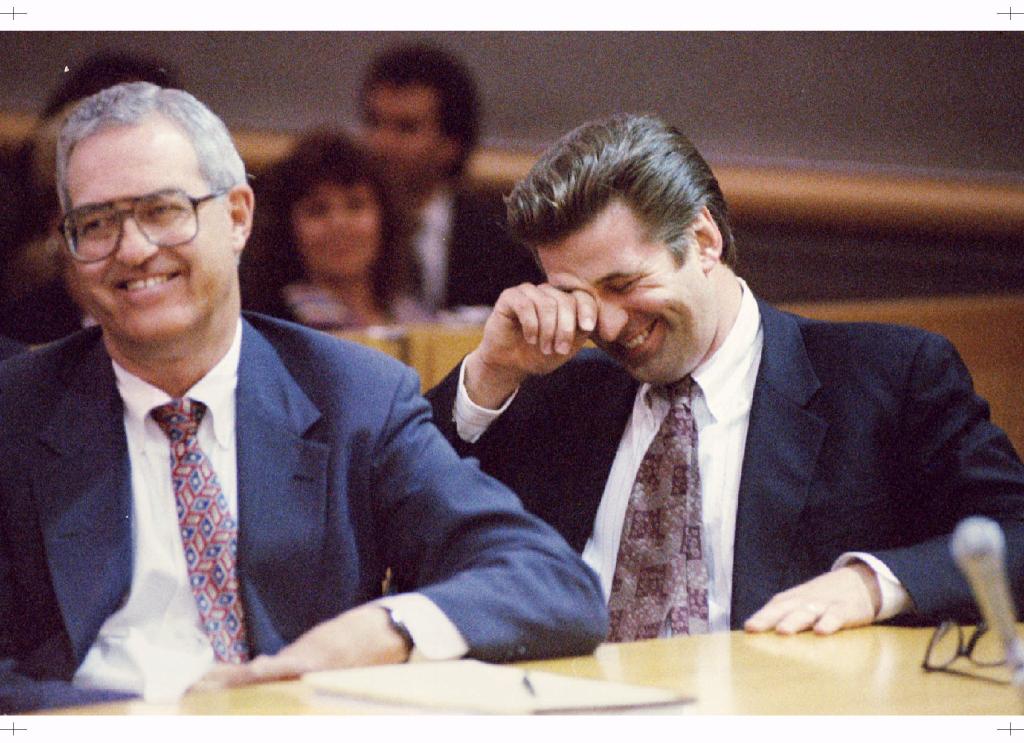 Baldwin laughing in court after getting acquitted of misdemeanor battery on celebrity photographer Alan Zanger in 1996.