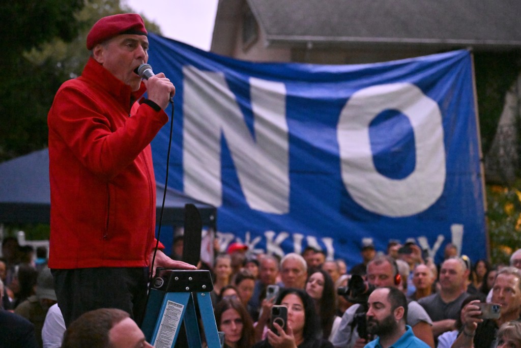 Former GOP mayoral candidate Curtis Sliwa speaking at the rally.