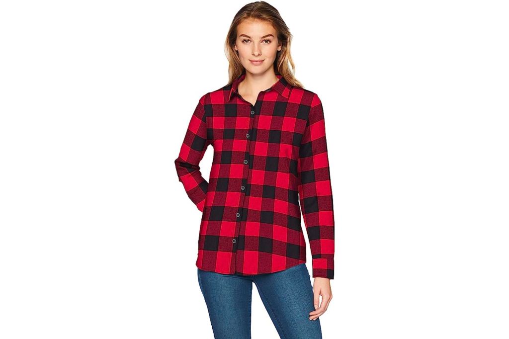 Woman in red and black flannel shirt, and a pair of jeans.