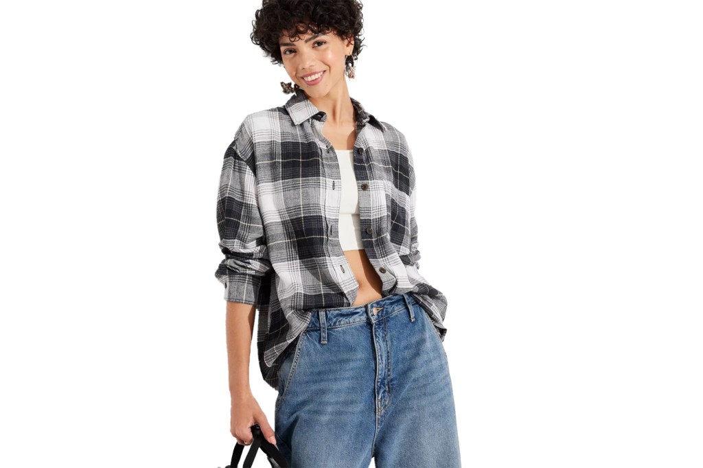 woman wearing flannel shirt and jeans