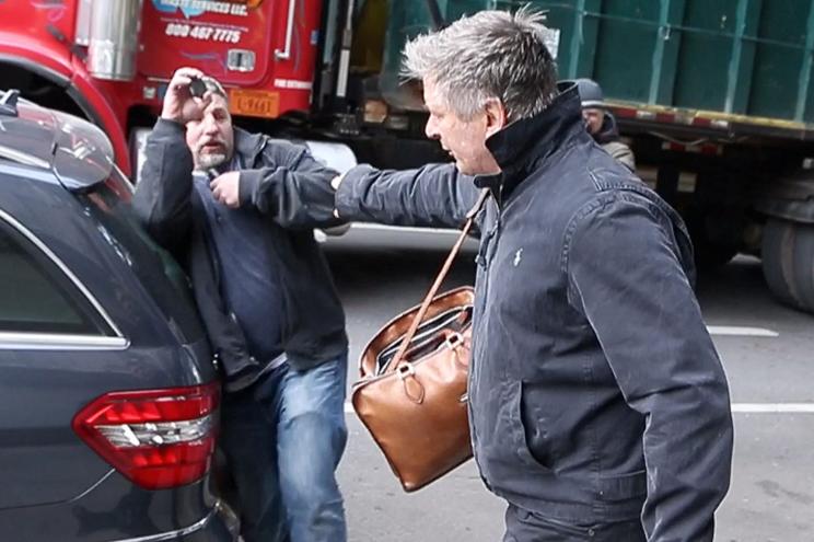 Alec Baldwin pushing a photographer while walking in New York City in 2013.