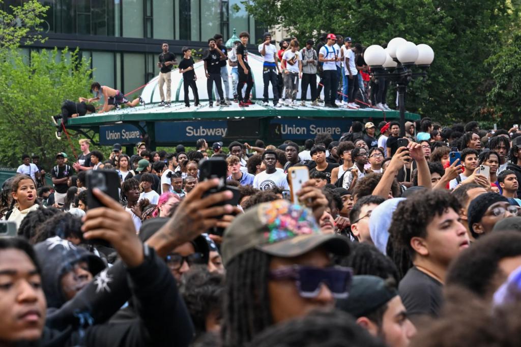 People on the roof of the Union Square subway station entrance during the riot that broke out during a giveaway event for Twitch stream Kai Cenat on August 4, 2023.