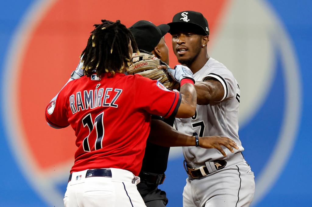 Jose Ramirez #11 of the Cleveland Guardians and Tim Anderson #7 of the Chicago White Sox start to fight as umpire Malachi Moore #44 gets between them during the sixth inning at Progressive Field on August 05, 2023 in Cleveland, Ohio. 