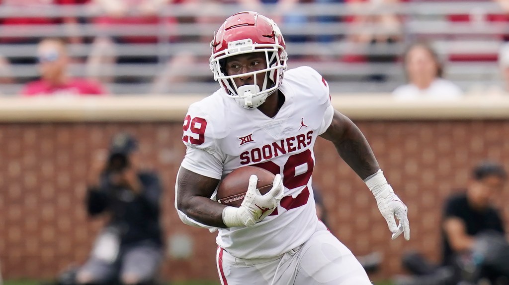 Tawee Walker runs with the football.