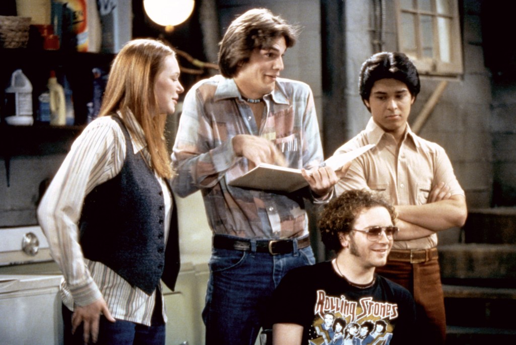 Laura Prepon, Ashton Kutcher, Danny Masterson and Wilmer Valderrama on the set of 'That 70s Show.'