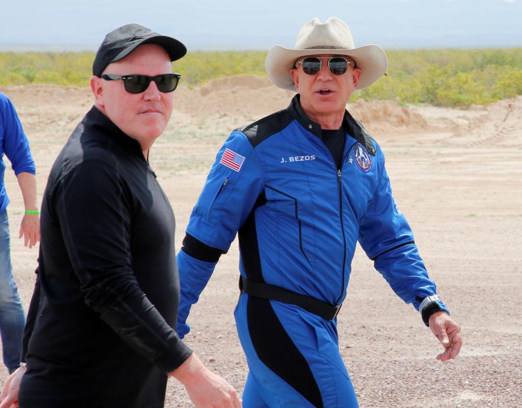 Blue Origin CEO Bob Smith (pictured with Bezos) is retiring from the role, which he's held since 2017, on Dec. 4.