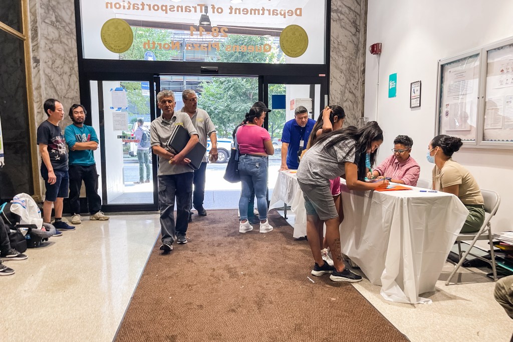 Families register at the school enrollment center in Long Island City. 