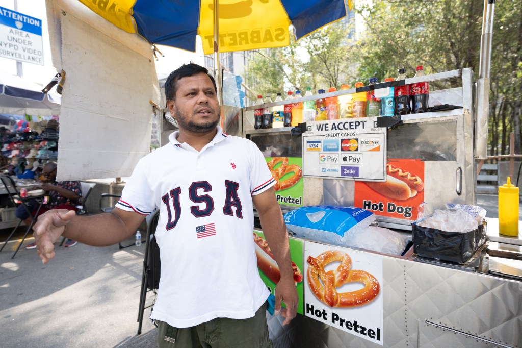 M.D. Rahman has been legally selling hot dogs and $1 water bottles near the entrance since 2003.