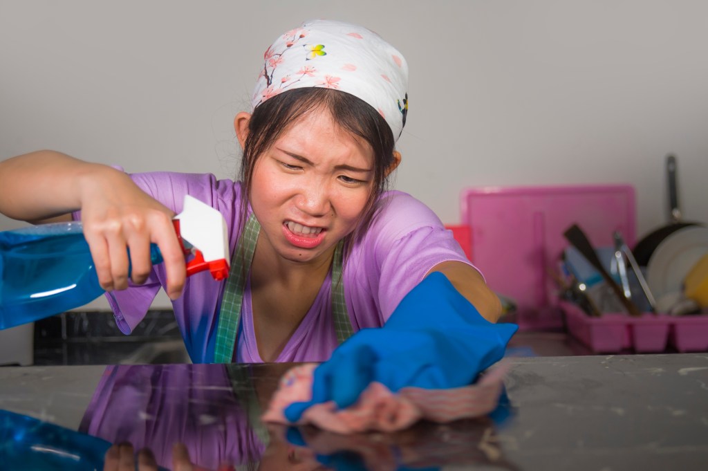 A stressed out maid hard at work. 