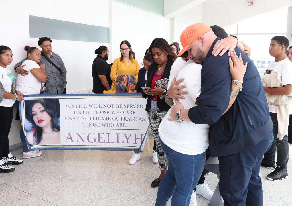 Yanely Henriquez and Manuel Yambo (Angellyh’s father) hugged after hearing the sentencing of Jeremiah Ryan.