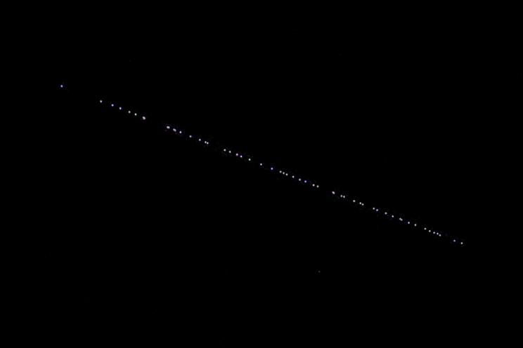 Dozens of lights were seen soaring in a straight line over New Jersey on Saturday.