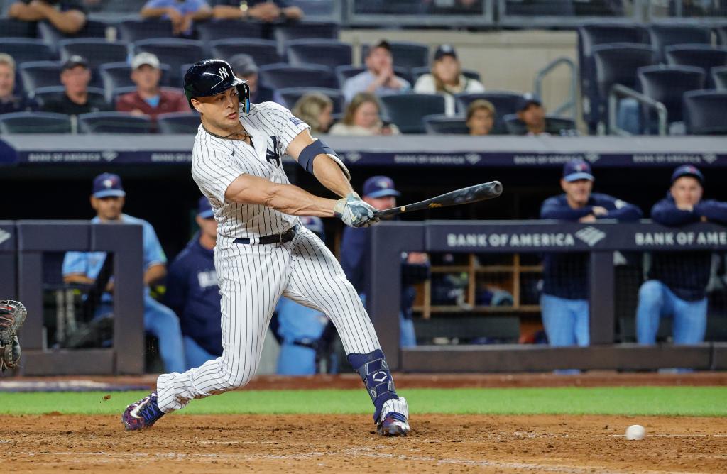 Giancarlo Stanton hits into a double play forcing Aaron Judge out at second base and ending the 9th inning against the Blue Jays on Tuesday.