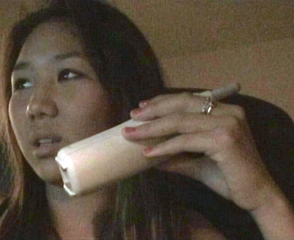 Rachel Lee as a teen on the phone.