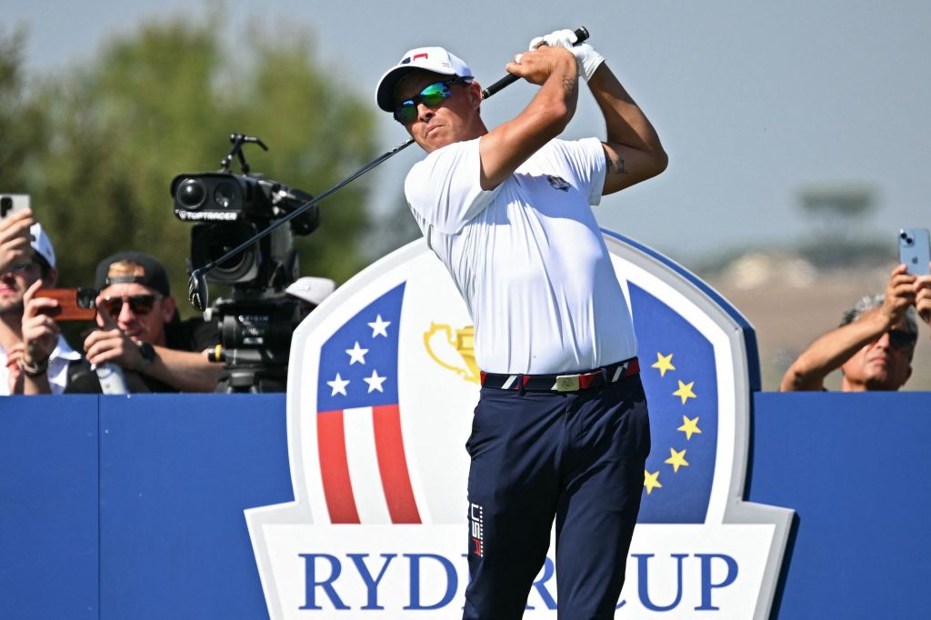 Rickie Fowler watches his shot from the 11th tee during practice.
