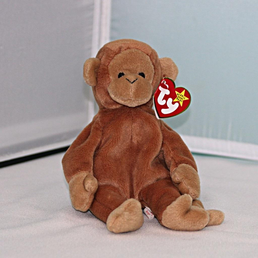 Bongo The Monkey Beanie Baby sitting alone in a corner